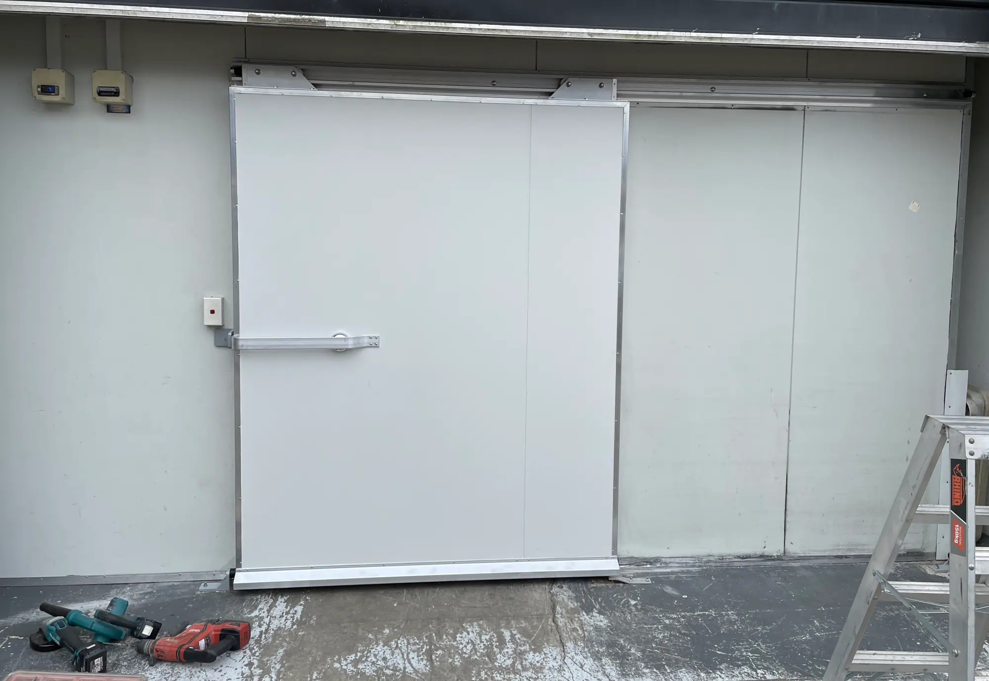 Custom insulated coolroom door with heavy duty seals and fittings